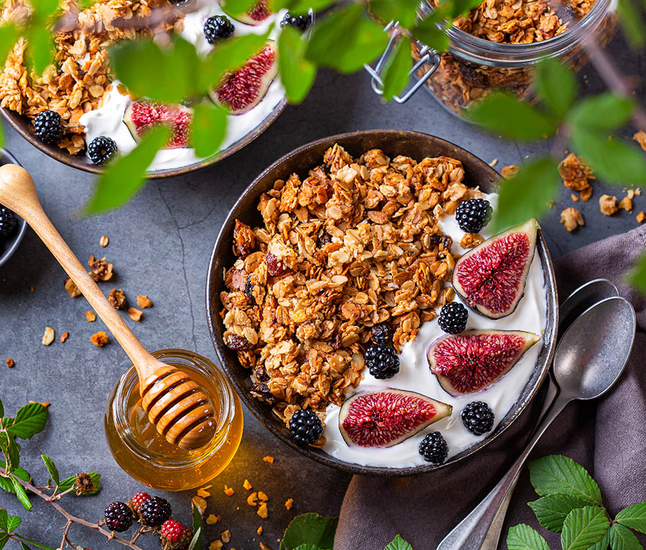 Homemade oat granola muesli with yogurt and berries for breakfast