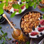 Homemade oat granola muesli with yogurt and berries for breakfast