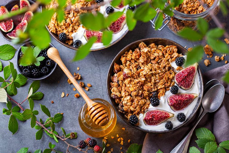 Homemade oat granola muesli with yogurt and berries for breakfast