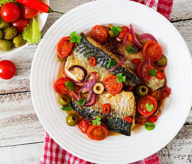 Grilled mackerel with vegetables in Mediterranean style.